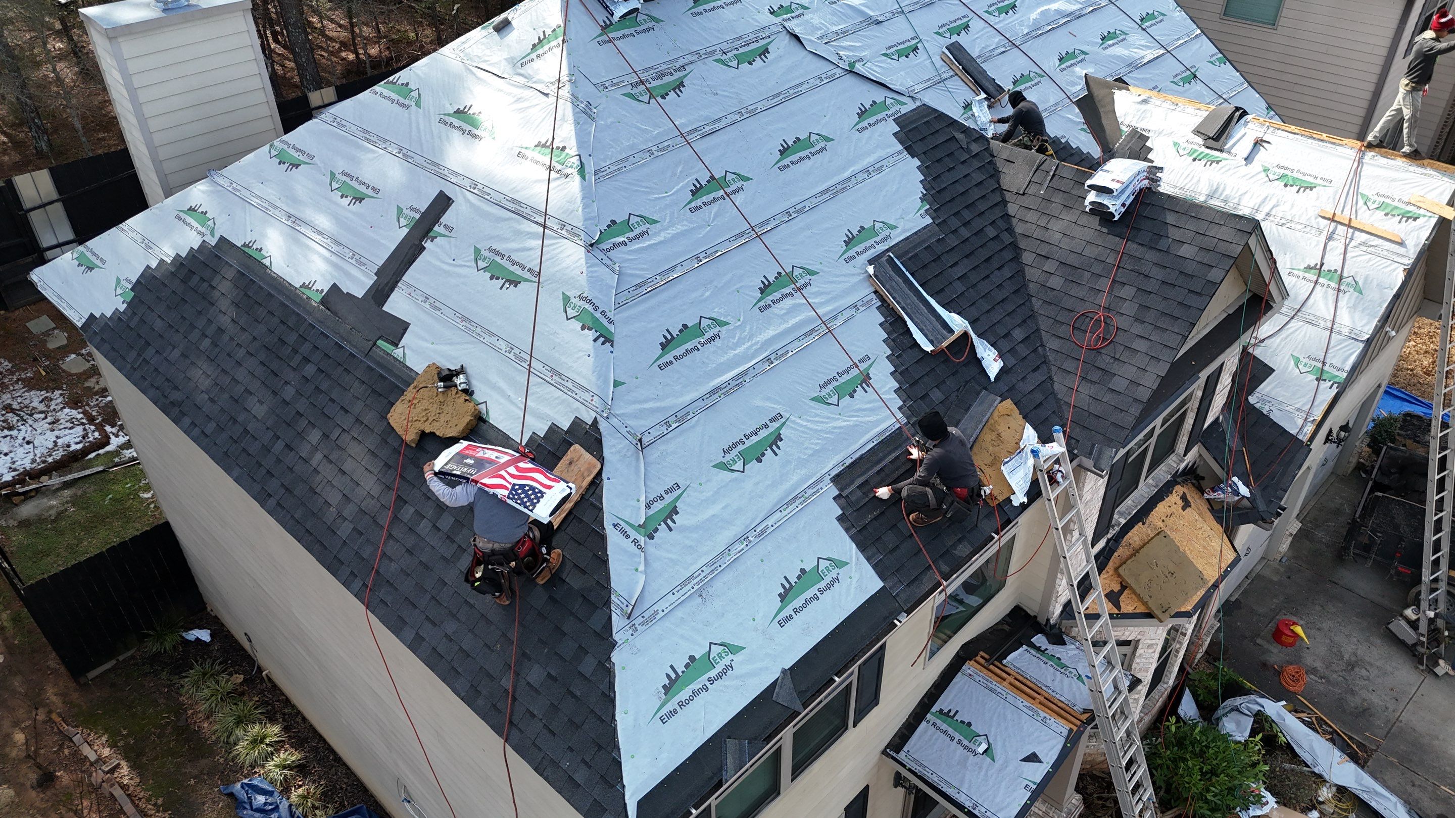 Storm Restoration ATL crew installing a new roof on a Georgia home